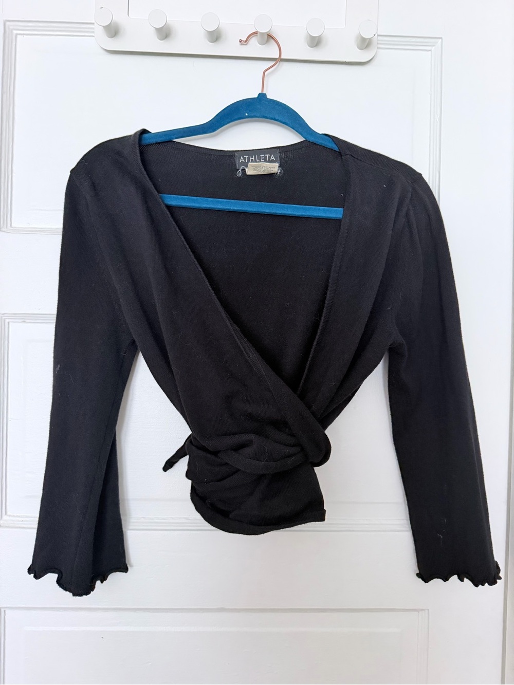 Athleta 100% cotton wrap top features a deep V-neckline